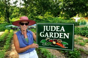 Denise with Judea Garden sign